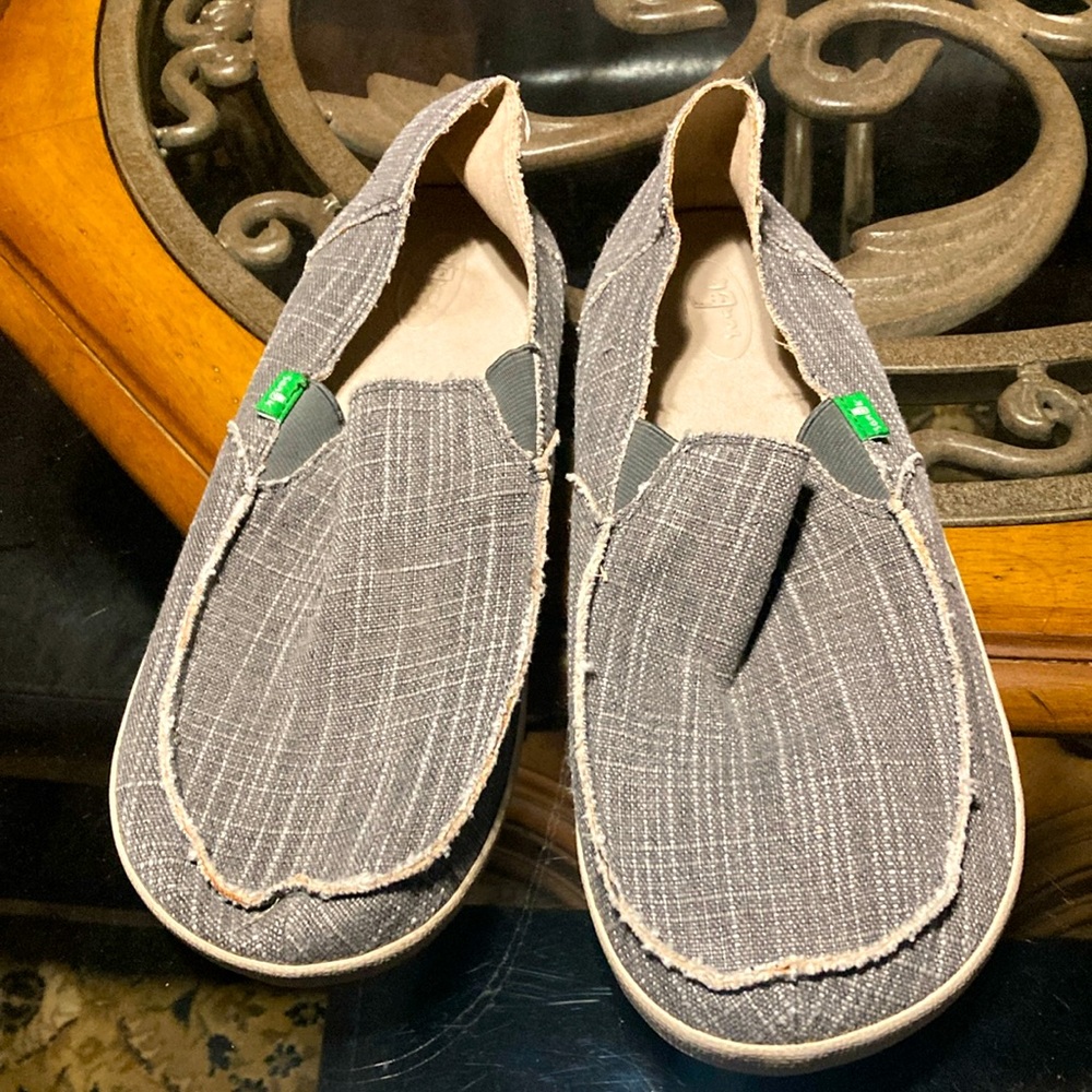 Sanuk’s men’s Slip Ons, 
Size 12, Nice Slip Ons with a hard shoe bottom.